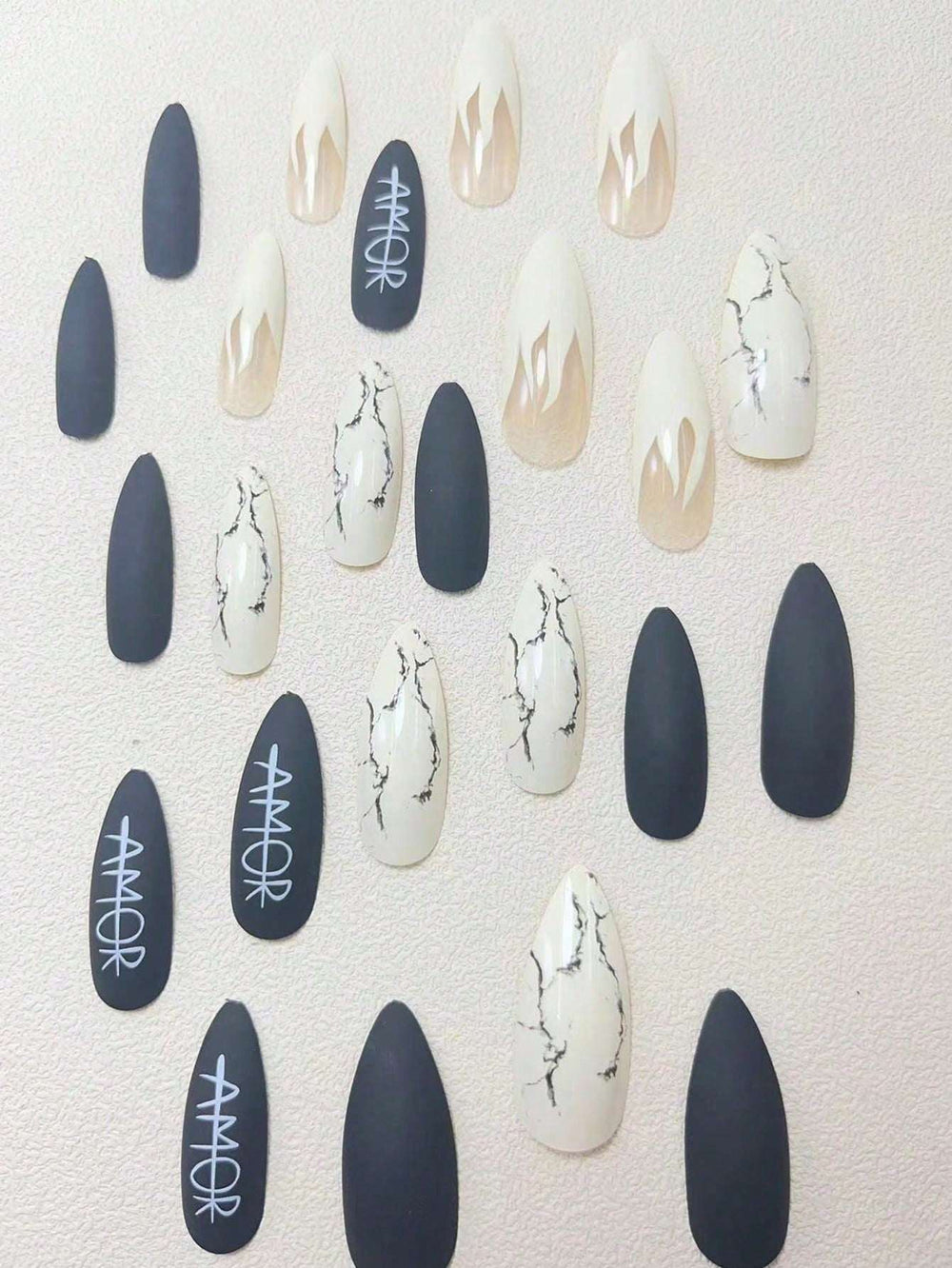 Shein 24 pieces of flame-themed stiletto nails with a white letter design